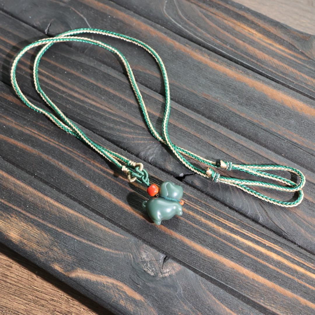 Nephrite dark green Jade puppy pendant