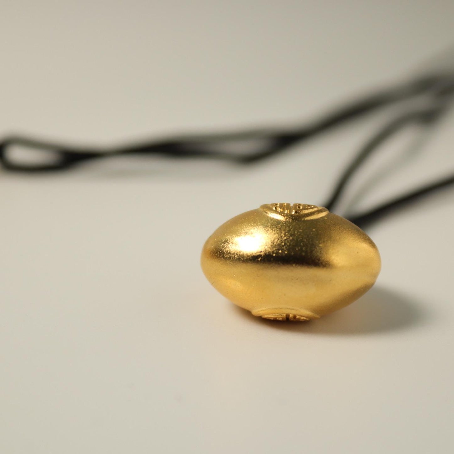 24K gold blissful lock pendant