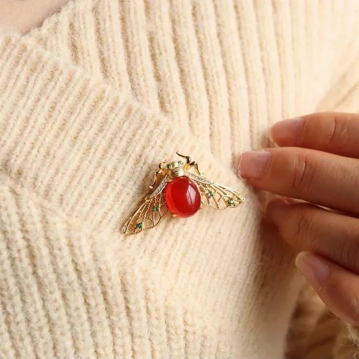 Baoshan icy red agate bee brooch