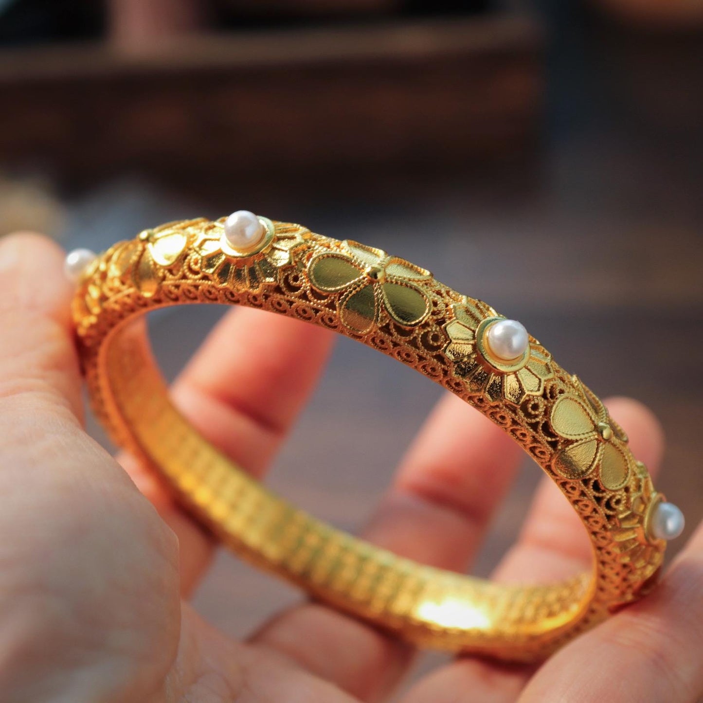 Chinese style pearl and 24k gold bangle with heart sutra inscription