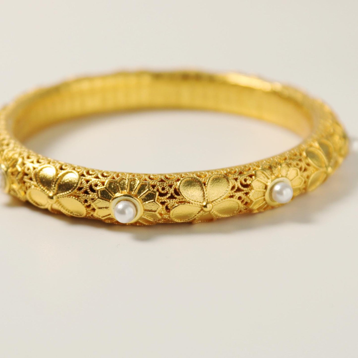Chinese style pearl and 24k gold bangle with heart sutra inscription