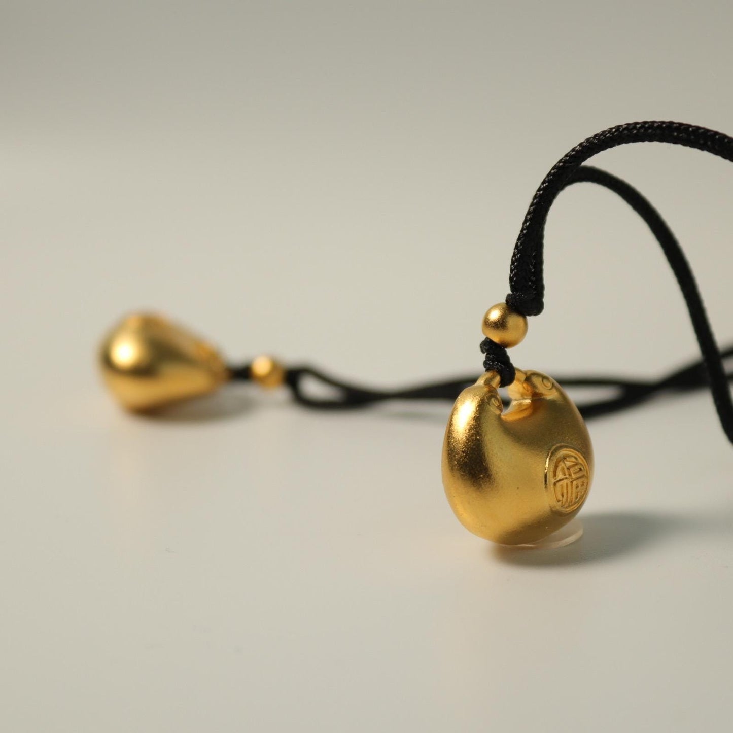 24K gold blissful lock pendant