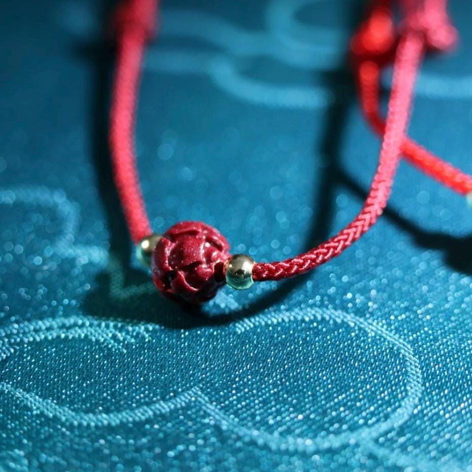 Auspicious adjustable red cord bracelet with cinnabar lotus bead/ fortune bracelet