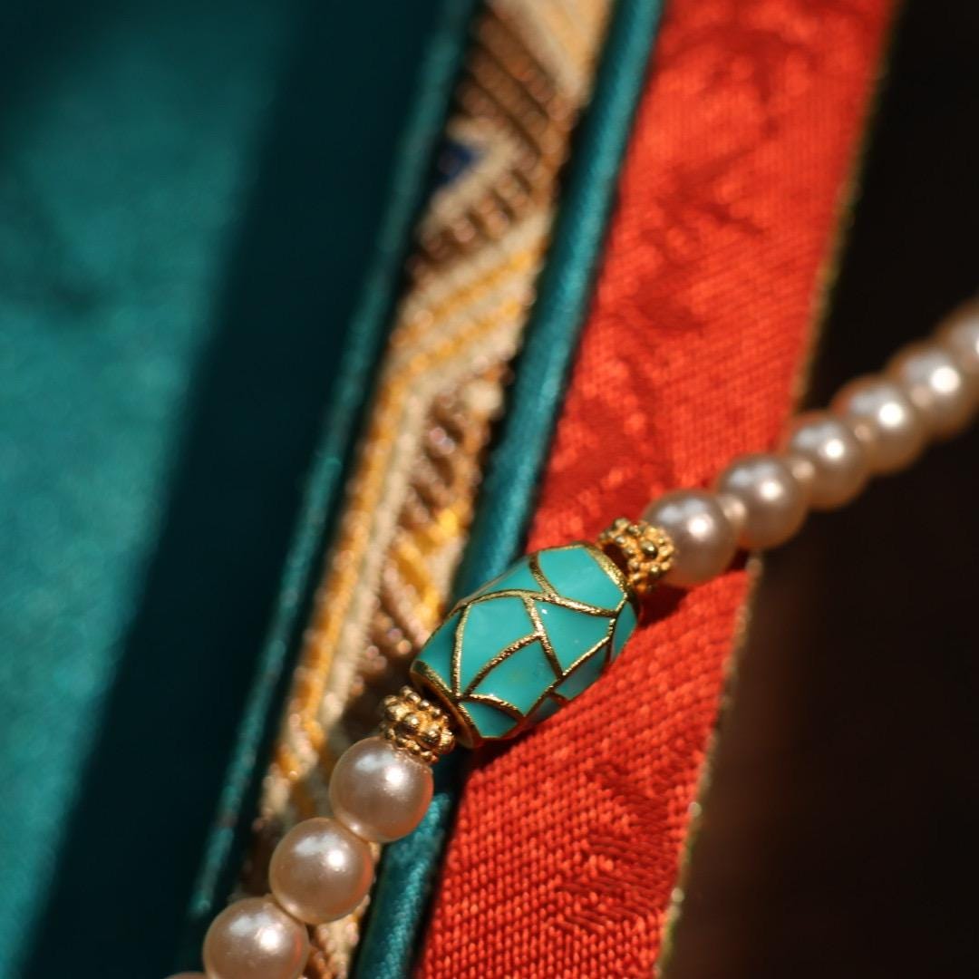 Traditional Chinese longevity lock pendant with faux pearl necklace